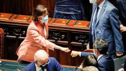 Italy’s minister of justice Marta Cartabia receives congratulations from the deputies after the final vote on the reform of justice