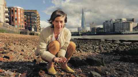 Jeweller Ruth Tomlinson on the Thames shore near the Millennium Bridge