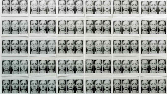 Multiple rows of black and white photos of a woman blinking and sighing