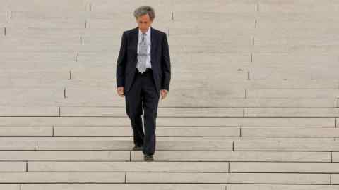 Conservative activist Edward Blum walks down the steps of the US Supreme Court