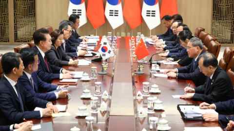 South Korea’s President Yoon Suk Yeol, third from left, holds talks with Chinese premier Li Qiang, sitting opposite, in Seoul on Sunday